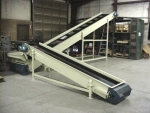 Shredder discharge belt conveyor with magnetic head pulley, diverter chute and sidewall belt; Feeds granulator infeed belt conveyor.